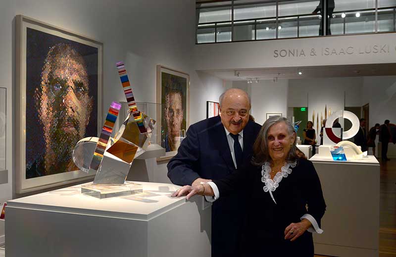Sonia and Isaac Luski pose in their gallery