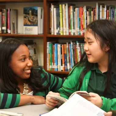 A teacher talks to her student