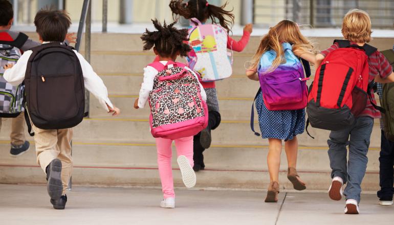 kids running into school