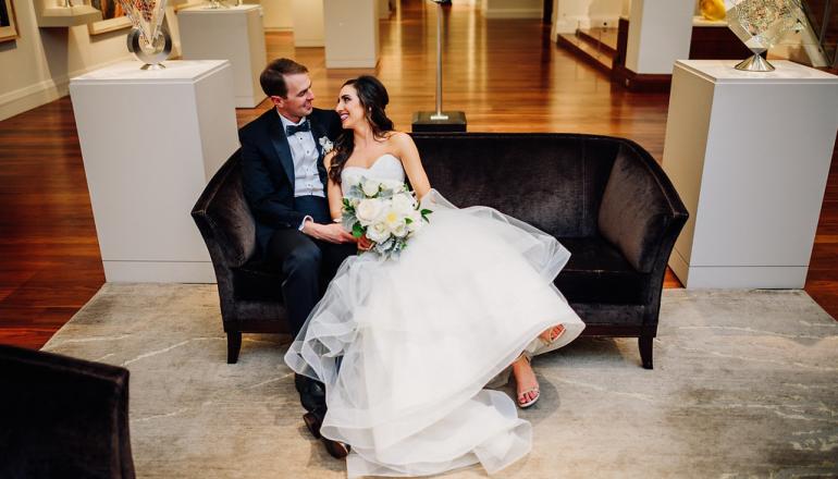 bride and groom in the art gallery